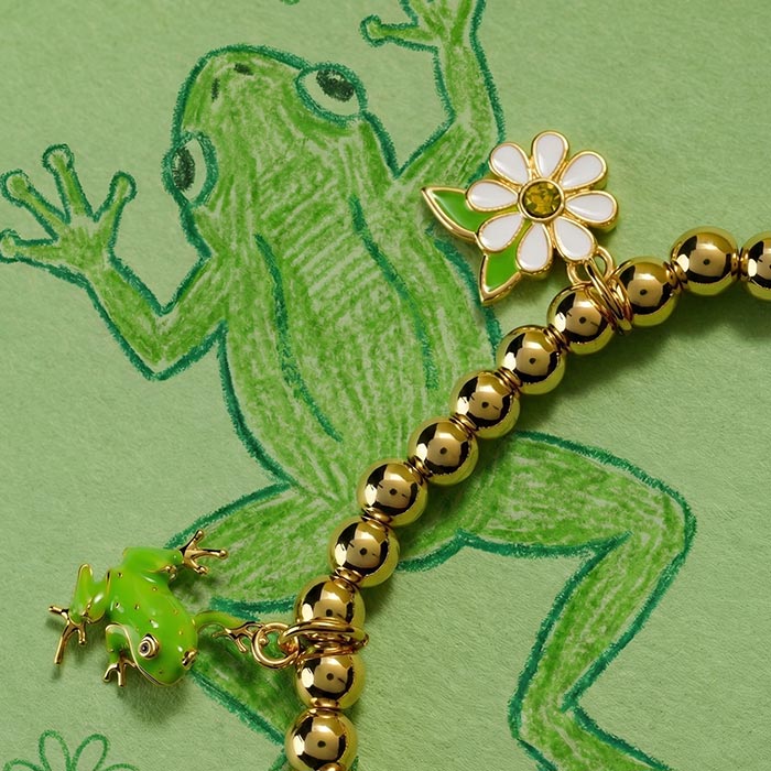 Crayola Charm Stretch Bracelet. Forest Green bracelet frog and daisy charms.