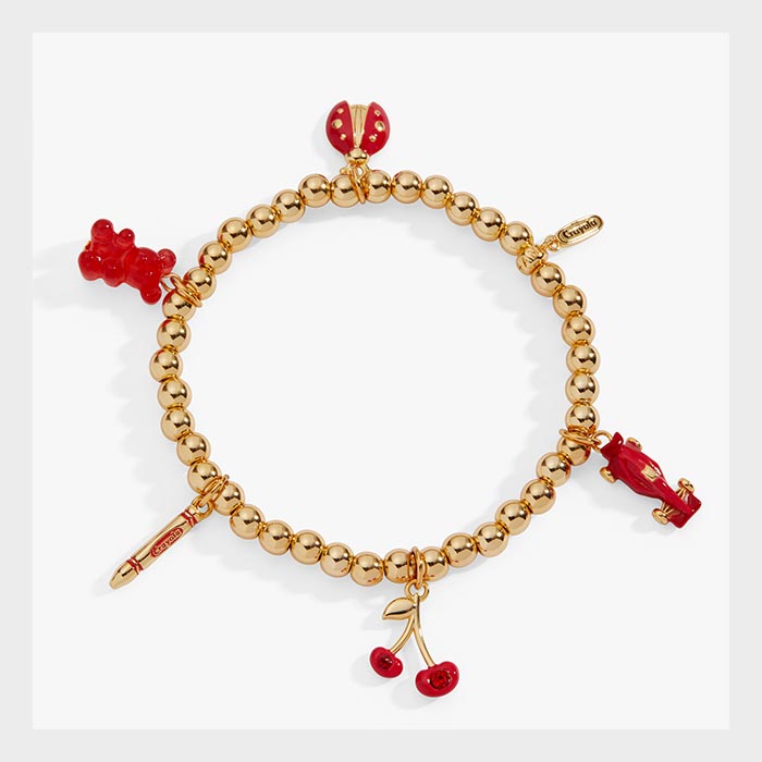 Crayola Charm Stretch Bracelet. gold bracelet with scarlet charms.