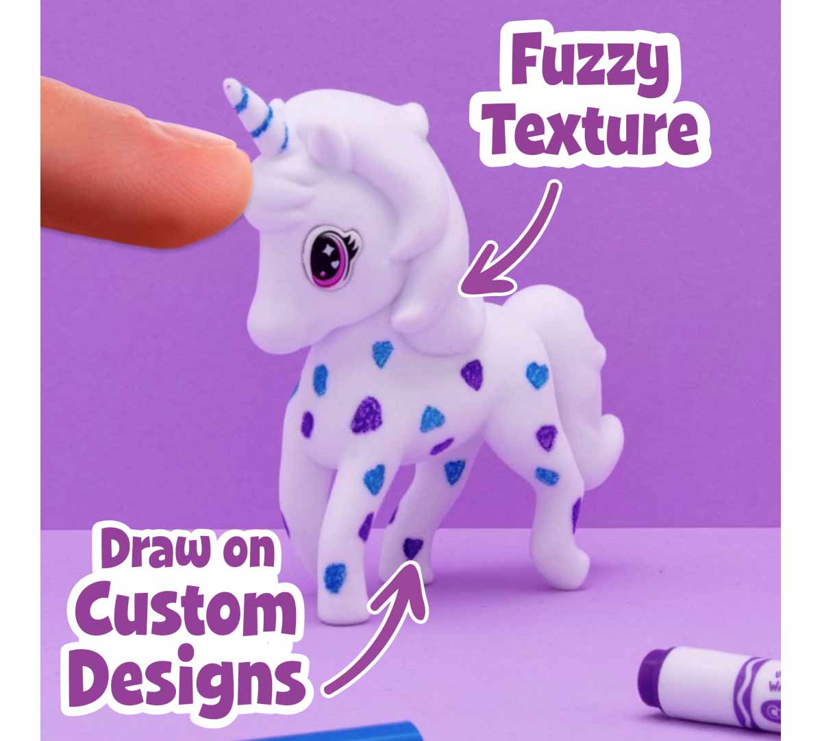 Scribble Scrubbie Pets Confetti Party Playset. fuzzy texture. draw on custom designs. finger touching unicorn pet with blue and purple decorations.